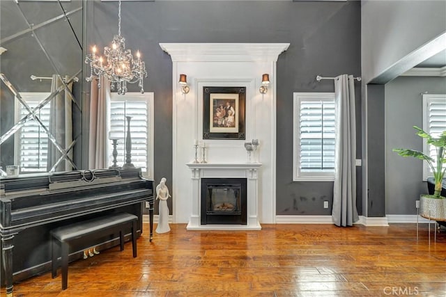 1610 Via Roma Cir, Corona, CA 92881 - sitting room featuring hardwood / wood-style flooring, a chandelier, and a glass covered fireplace