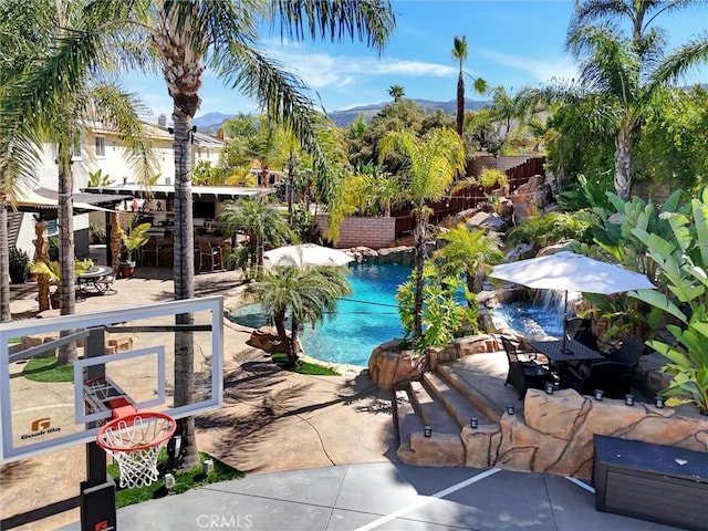 1610 Via Roma Cir, Corona, CA 92881 - view of swimming pool featuring a fenced backyard, a mountain view, a patio area, and outdoor dining area