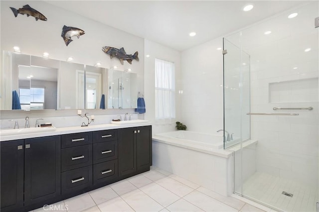 bathroom with a shower stall and a sink