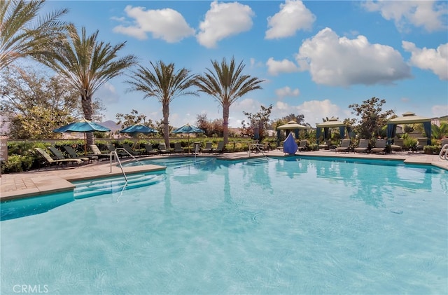 pool featuring a gazebo and a patio