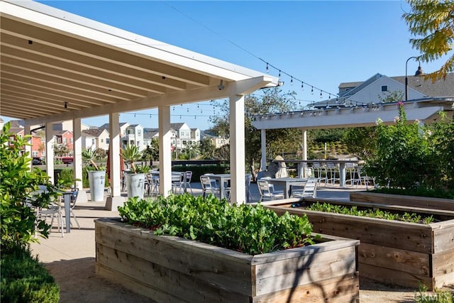 view of patio featuring a residential view and outdoor dining area