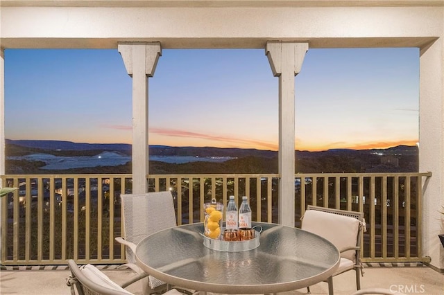 interior space with outdoor dining space and a mountain view