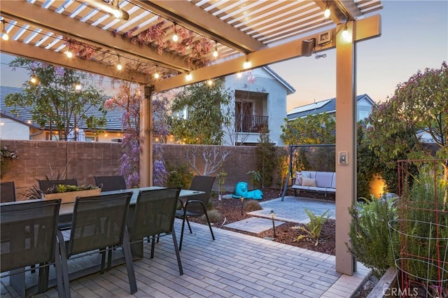 view of patio with a fenced backyard, a pergola, outdoor dining space, and an outdoor hangout area