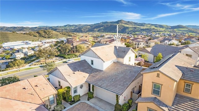drone / aerial view featuring a residential view and a mountain view