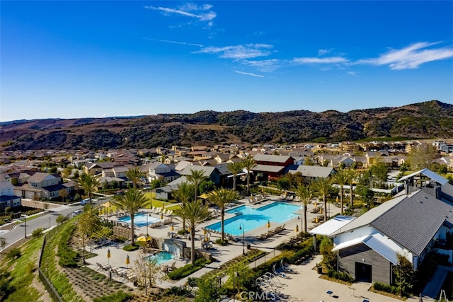 drone / aerial view with a residential view and a mountain view