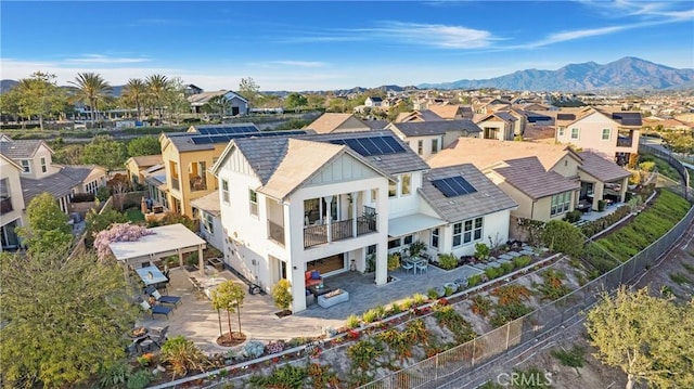 drone / aerial view with a residential view and a mountain view