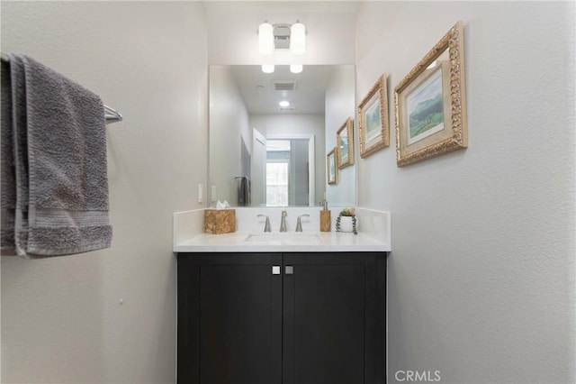 bathroom with visible vents and vanity