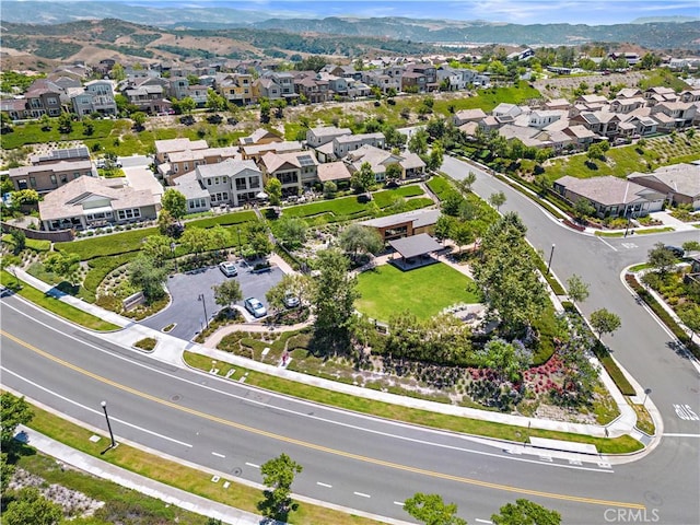 drone / aerial view featuring a mountain view and a residential view