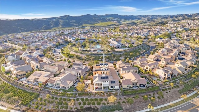 birds eye view of property with a mountain view and a residential view