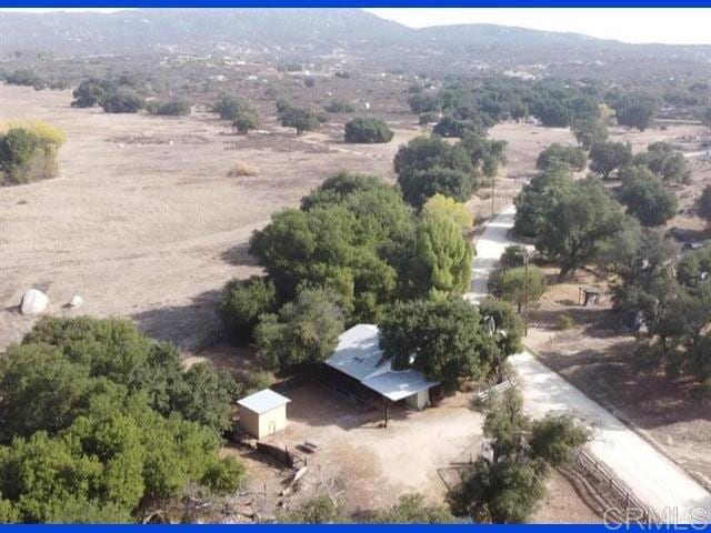 aerial view featuring a mountain view and a rural view