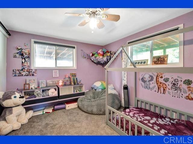 bedroom featuring ceiling fan and carpet flooring
