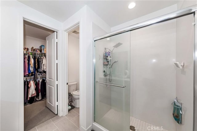 14161 Olivia Ct, La Mirada, CA 90638 - full bathroom with a spacious closet, toilet, tile patterned floors, and a stall shower