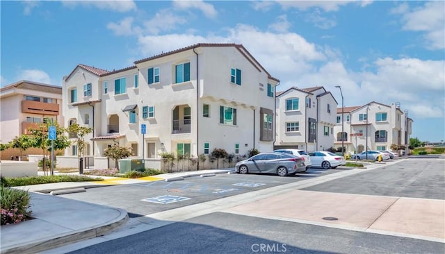 14161 Olivia Ct, La Mirada, CA 90638 - view of building exterior featuring uncovered parking and a residential view