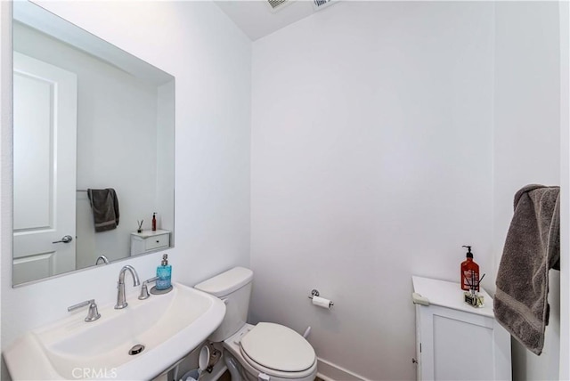 14161 Olivia Ct, La Mirada, CA 90638 - half bath with toilet, baseboards, and a sink