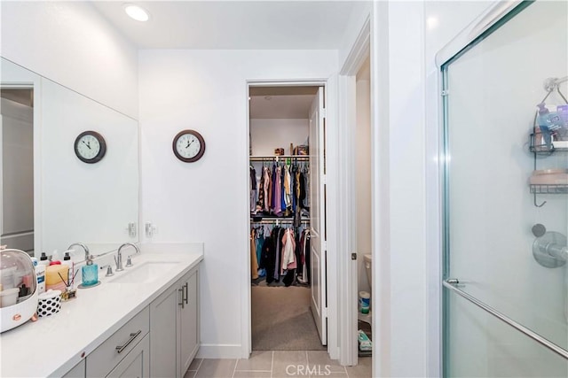 14161 Olivia Ct, La Mirada, CA 90638 - full bath featuring vanity, tile patterned flooring, a spacious closet, and a stall shower