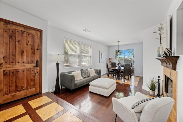 11891 Ramsdell Ct, San Diego, CA 92131 - living room with baseboards, hardwood / wood-style floors, and visible vents