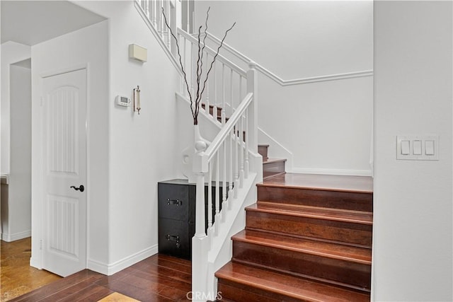 11891 Ramsdell Ct, San Diego, CA 92131 - stairs featuring wood finished floors and baseboards
