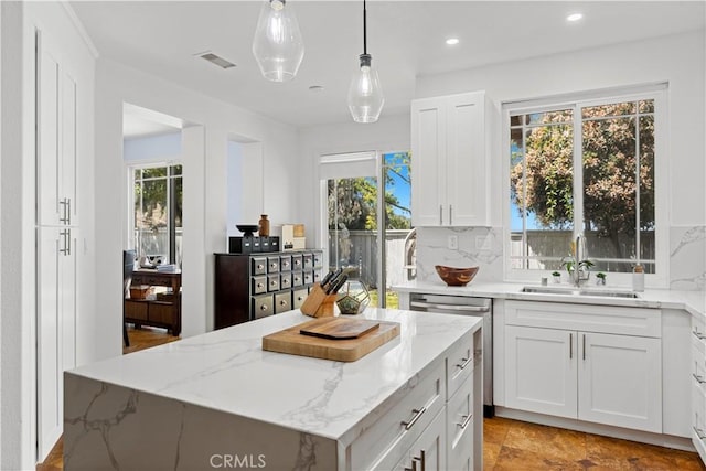 11891 Ramsdell Ct, San Diego, CA 92131 - kitchen with a sink, white cabinets, stainless steel dishwasher, visible vents, and light stone countertops