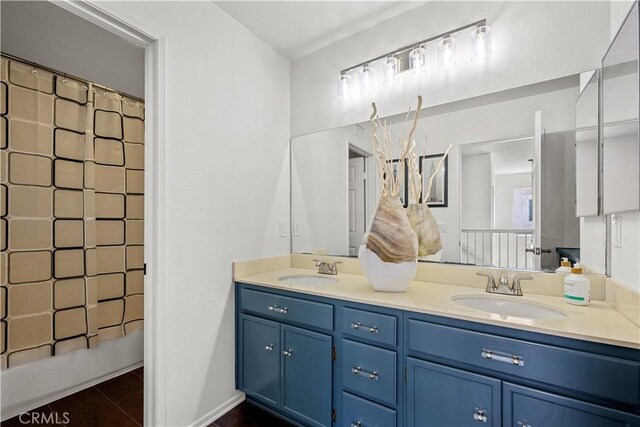11891 Ramsdell Ct, San Diego, CA 92131 - bathroom featuring double vanity, curtained shower, tile patterned flooring, and a sink