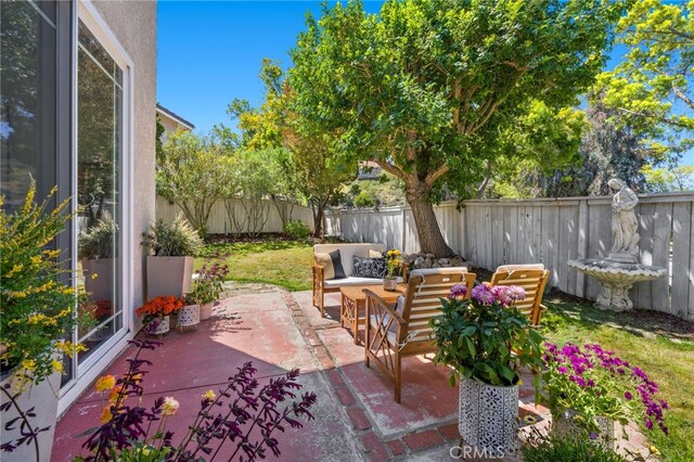 11891 Ramsdell Ct, San Diego, CA 92131 - view of patio / terrace featuring a fenced backyard and an outdoor hangout area