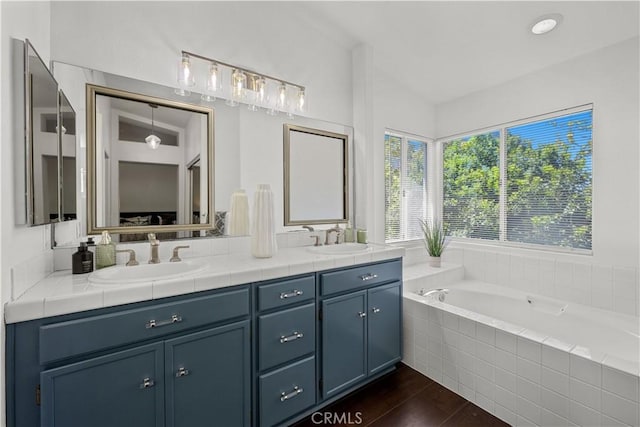 11891 Ramsdell Ct, San Diego, CA 92131 - full bathroom with a sink, double vanity, and wood finished floors