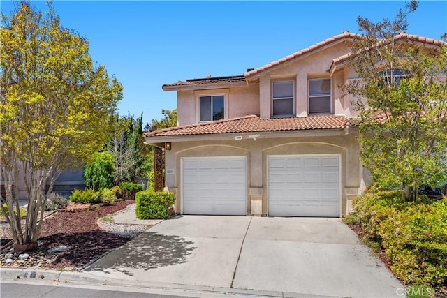 11891 Ramsdell Ct, San Diego, CA 92131 - mediterranean / spanish house featuring a garage, stucco siding, roof mounted solar panels, concrete driveway, and a tiled roof