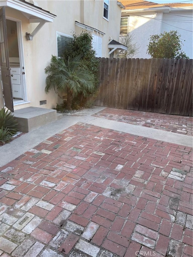 258 Glendora Ave, Long Beach, CA 90803 - view of patio featuring entry steps, fence, and visible vents