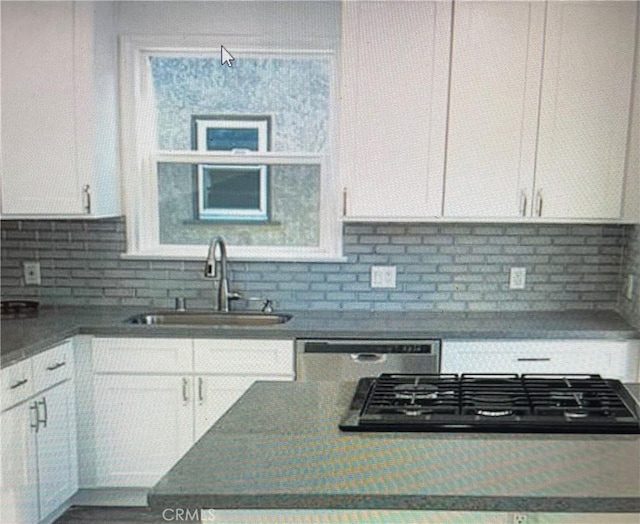 258 Glendora Ave, Long Beach, CA 90803 - kitchen with backsplash, black gas cooktop, dishwashing machine, white cabinetry, and a sink