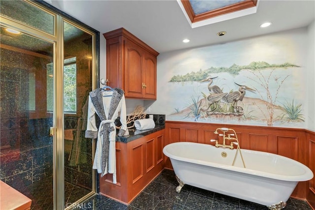 28019 N Shore Rd, Lake Arrowhead, CA 92352 - bathroom with granite floors, wainscoting, a freestanding tub, a stall shower, and recessed lighting