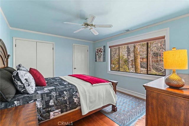 28019 N Shore Rd, Lake Arrowhead, CA 92352 - bedroom featuring wood finished floors, crown molding, a ceiling fan, and a closet
