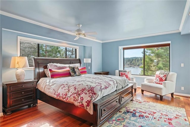 28019 N Shore Rd, Lake Arrowhead, CA 92352 - bedroom featuring wood finished floors, multiple windows, ornamental molding, and ceiling fan
