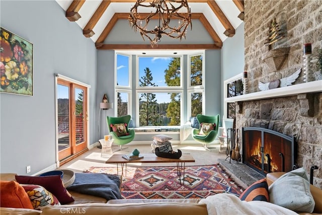 28019 N Shore Rd, Lake Arrowhead, CA 92352 - carpeted living area with high vaulted ceiling, a chandelier, beamed ceiling, and a stone fireplace