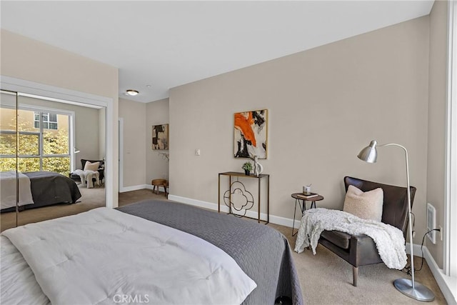 bedroom featuring carpet floors and baseboards