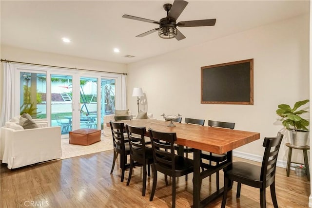 dining area with visible vents, a ceiling fan, wood finished floors, recessed lighting, and baseboards
