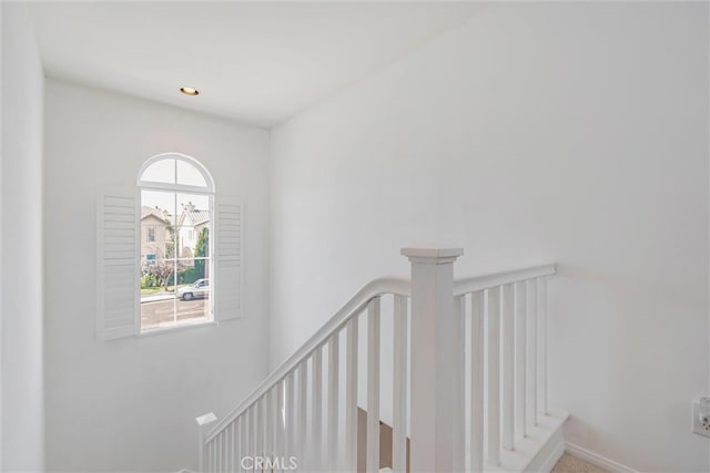 stairway featuring recessed lighting