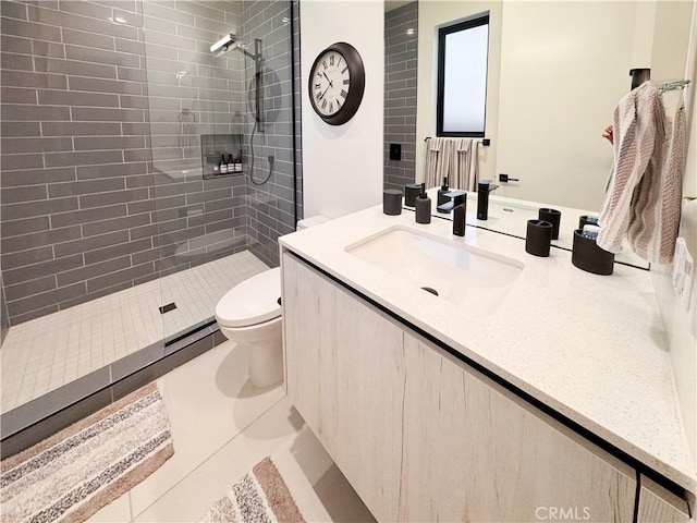 57601 Santo Thomas Ln, Quinta, CA 92253 - bathroom featuring tile patterned floors, toilet, vanity, and a tile shower