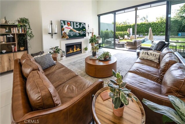 57601 Santo Thomas Ln, Quinta, CA 92253 - living room with tile patterned floors and a glass covered fireplace