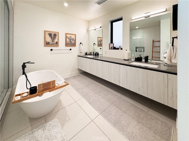 57601 Santo Thomas Ln, Quinta, CA 92253 - full bathroom with tile patterned flooring, double vanity, a tile shower, a freestanding tub, and a sink