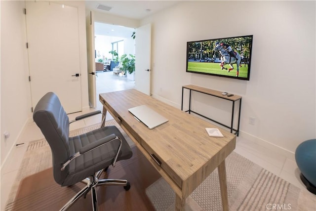 57601 Santo Thomas Ln, Quinta, CA 92253 - home office featuring visible vents, baseboards, and tile patterned flooring