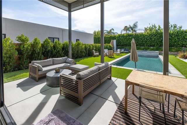 view of patio with outdoor lounge area and a fenced in pool