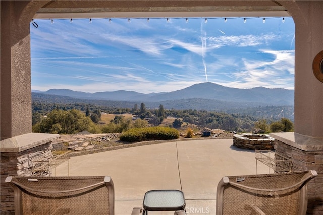 45500 Right Rd, Ahwahnee, CA 93601 - view of patio / terrace with a mountain view and an outdoor fire pit