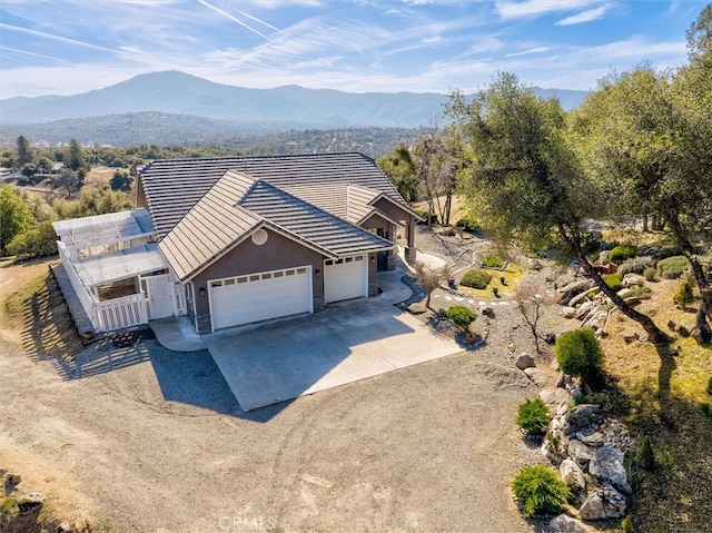 45500 Right Rd, Ahwahnee, CA 93601 - exterior space with driveway, stucco siding, a garage, a tile roof, and a mountain view