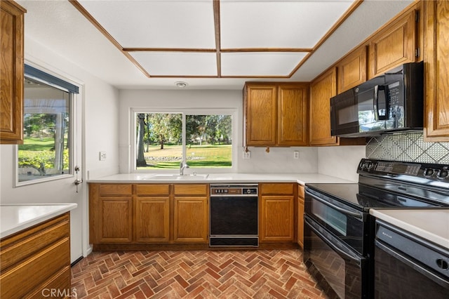 1021 Pebble Beach Dr, Upland, CA 91784 - kitchen featuring black appliances, a sink, brown cabinets, light countertops, and brick patterned flooring