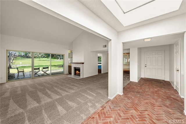 1021 Pebble Beach Dr, Upland, CA 91784 - entrance foyer featuring brick floors, baseboards, a brick fireplace, and high vaulted ceiling
