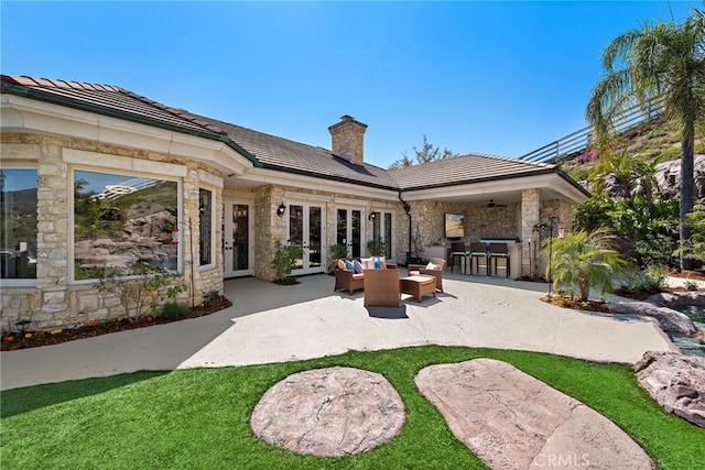 6 Via Presea, Coto De Caza, CA 92679 - back of house with french doors, stone siding, a patio area, and an outdoor living space
