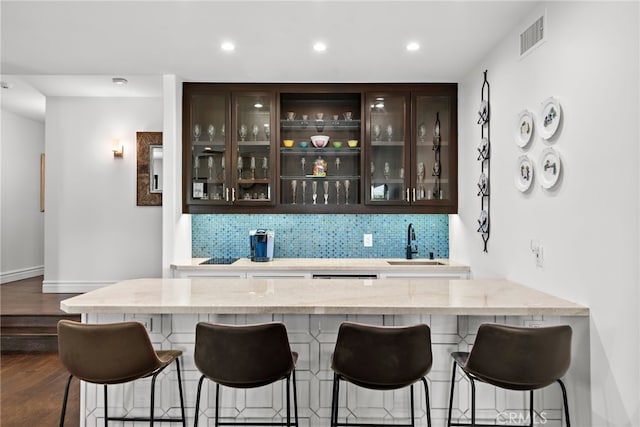 6 Via Presea, Coto De Caza, CA 92679 - indoor wet bar with decorative backsplash, dark wood-style floors, recessed lighting, and baseboards