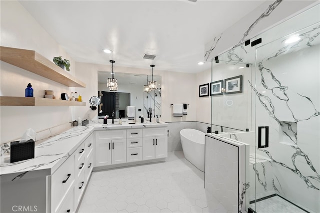 6 Via Presea, Coto De Caza, CA 92679 - bathroom with a marble finish shower, a freestanding tub, vanity, recessed lighting, and a chandelier