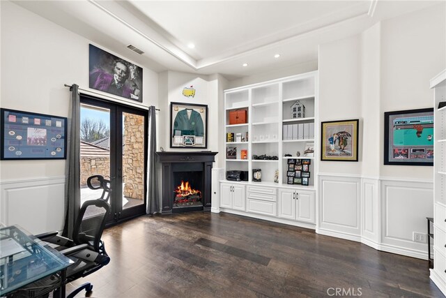 6 Via Presea, Coto De Caza, CA 92679 - office area featuring dark wood-style flooring, a lit fireplace, recessed lighting, a wainscoted wall, and french doors