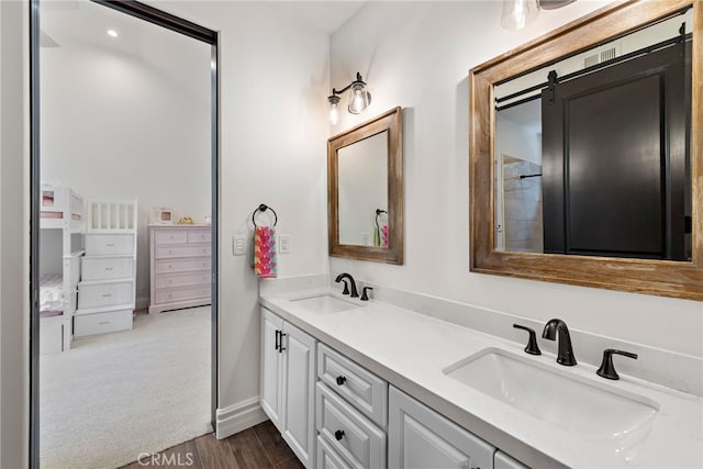 6 Via Presea, Coto De Caza, CA 92679 - bathroom featuring wood finished floors, double vanity, and baseboards