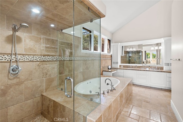 6 Via Presea, Coto De Caza, CA 92679 - full bathroom featuring a shower stall, stone tile flooring, a bath, high vaulted ceiling, and vanity